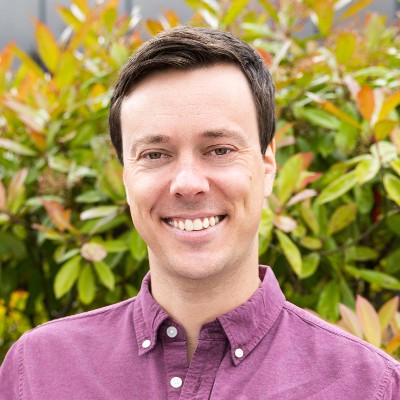 Smiling-Farallon-employee-with-short-hair-wearing-purple-shirt